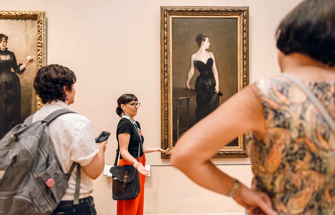 Visitors exploring exhibits at the Metropolitan Museum of Art, New York, during a guided highlights tour.