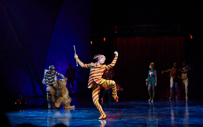Performer in colorful costume during Kooza stage show in Brisbane.
