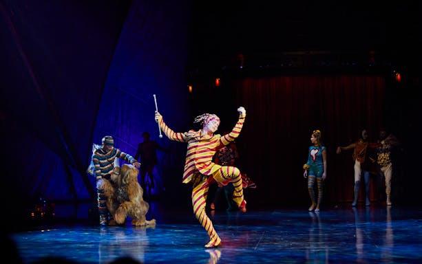 Performer in colorful costume during Kooza stage show in Brisbane.