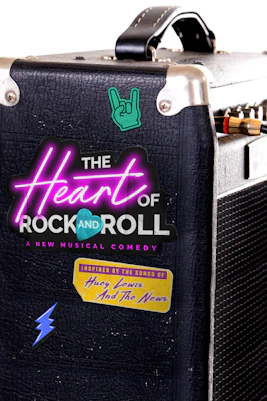 Band performing live on stage with vibrant lights at The Heart of Rock and Roll event.