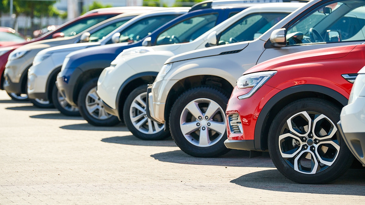Rental cars lined up in Morocco parking lot.