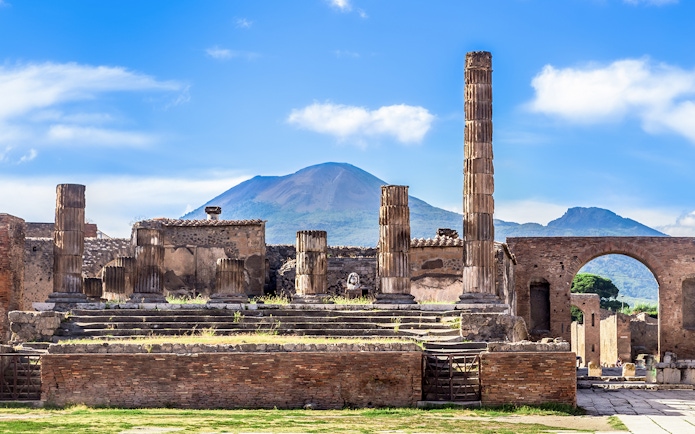Ruins of Pompeii with Mount Vesuvius in the background.