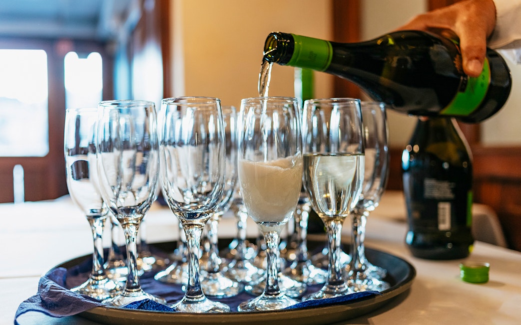 Glasses being filled with champagne on New Year’s Eve Cruise in Budapest.