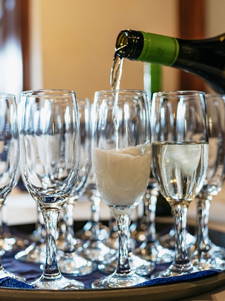 Glasses being filled with champagne on New Year’s Eve Cruise in Budapest.