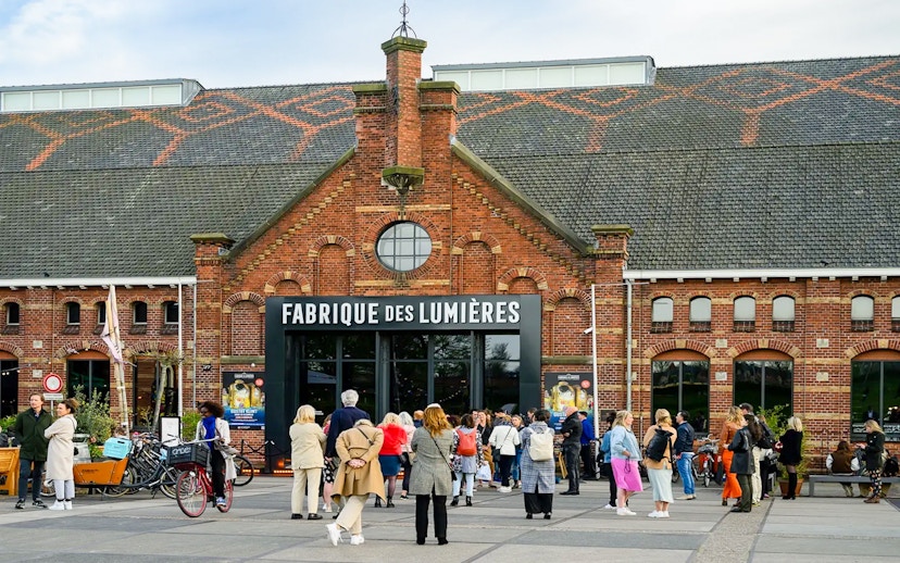 Visitors outside Fabrique des Lumières in Amsterdam, part of a combo ticket offer.