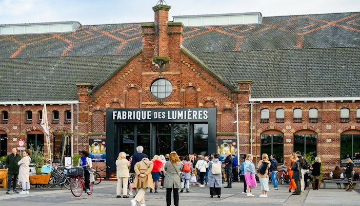 Visitors outside Fabrique des Lumières in Amsterdam, part of a combo ticket offer.