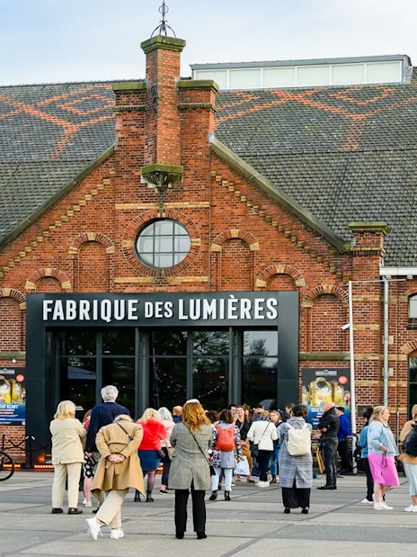 Visitors outside Fabrique des Lumières in Amsterdam, part of a combo ticket offer.