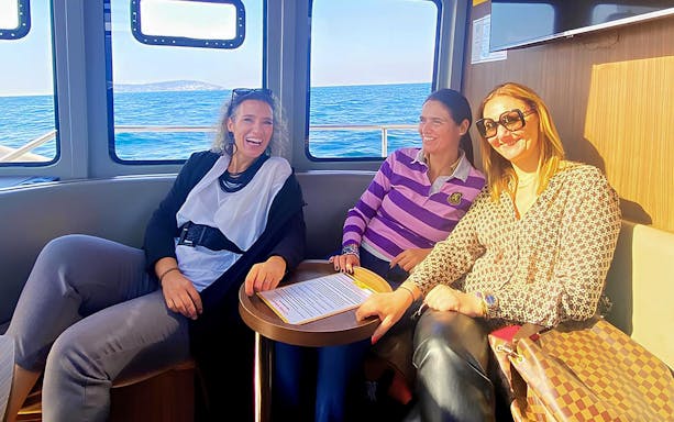 Ferry ride to Princess Island with guests on deck enjoying the scenic view of Istanbul's skyline.