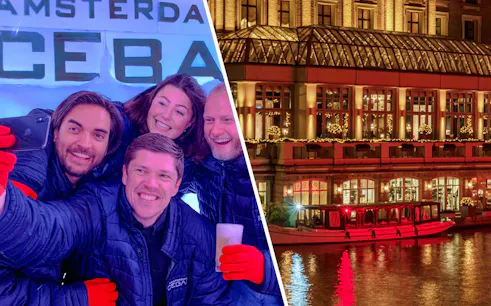 Visitors enjoying drinks at Icebar Amsterdam with canal view at night.