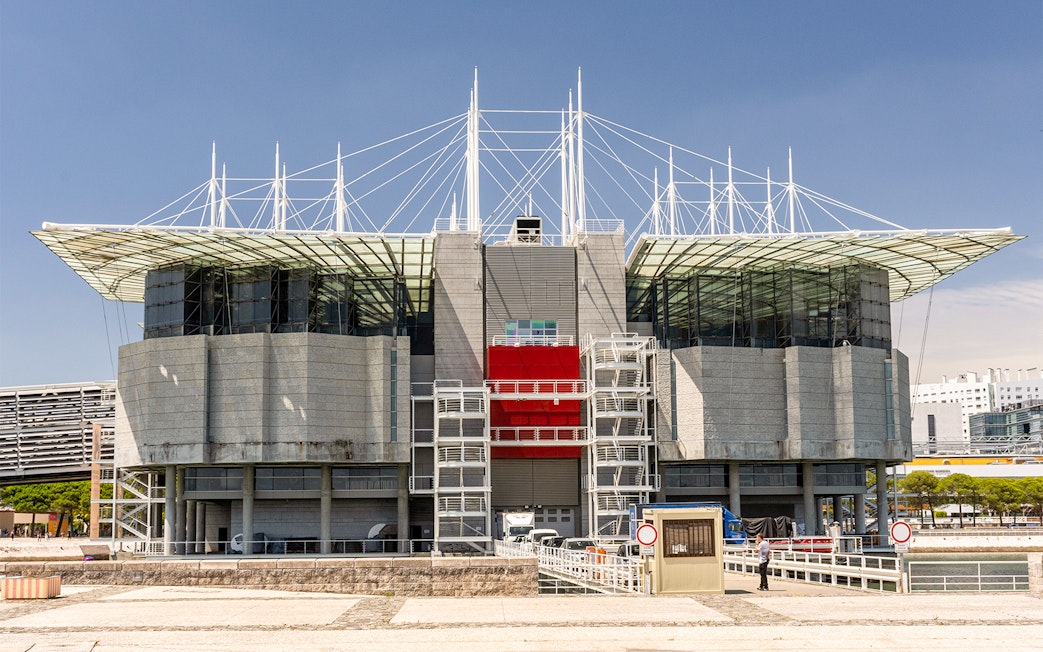 Lisbon Oceanarium exterior with modern architecture and glass facade.