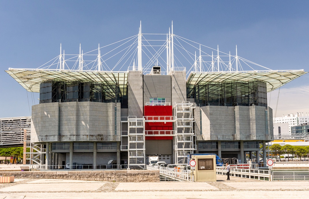 Lisbon Oceanarium exterior with modern architecture and glass facade.