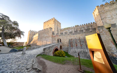 St George's Castle in Lisbon with stone walls and entrance bridge.