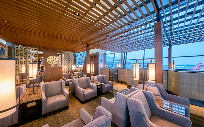 Sapphire Lounge seating area, T3 International Departures, near Gate 7, with modern decor and large windows.
