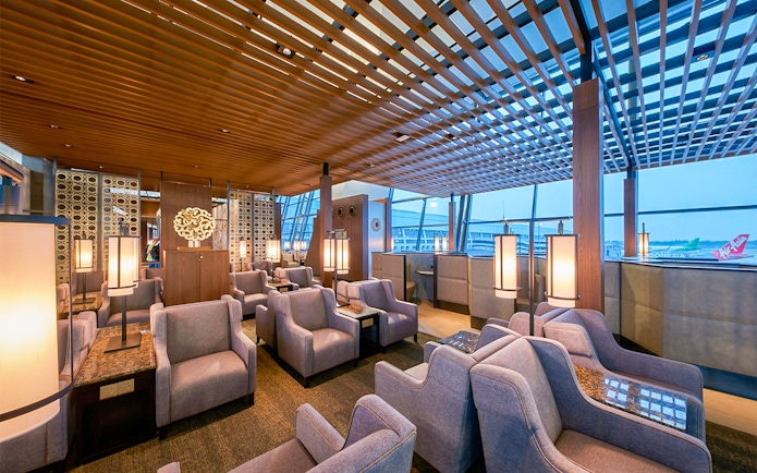Sapphire Lounge seating area, T3 International Departures, near Gate 7, with modern decor and large windows.