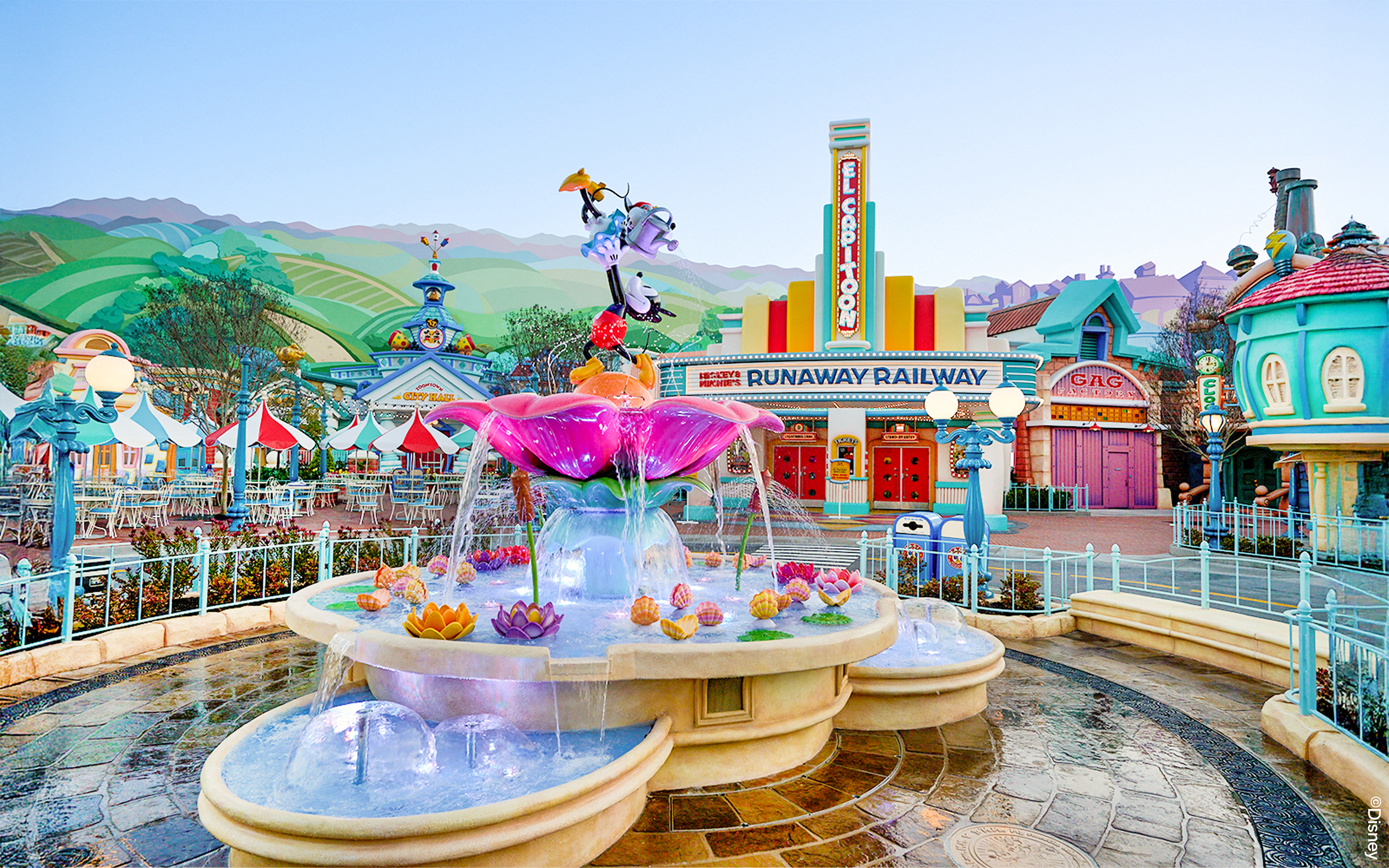 Fountain and colorful buildings in Mickey's Toontown, Disneyland Park, California.