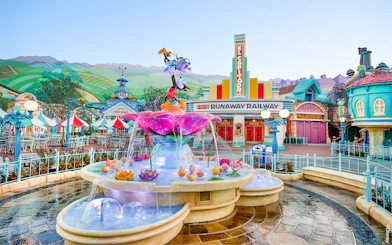 Fountain and colorful buildings in Mickey's Toontown, Disneyland Park, California.
