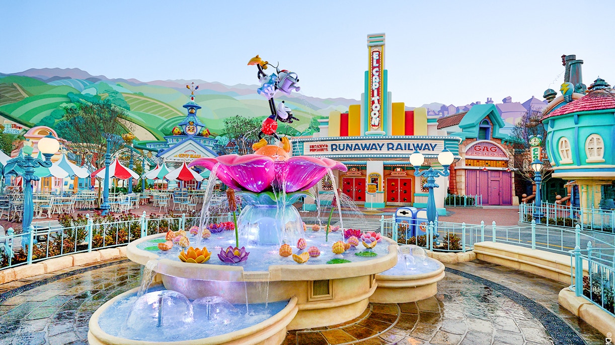 Fountain and colorful buildings in Mickey's Toontown, Disneyland Park, California.