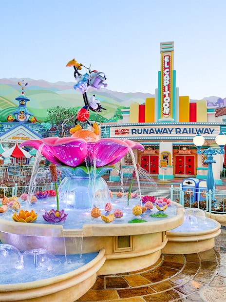 Fountain and colorful buildings in Mickey's Toontown, Disneyland Park, California.