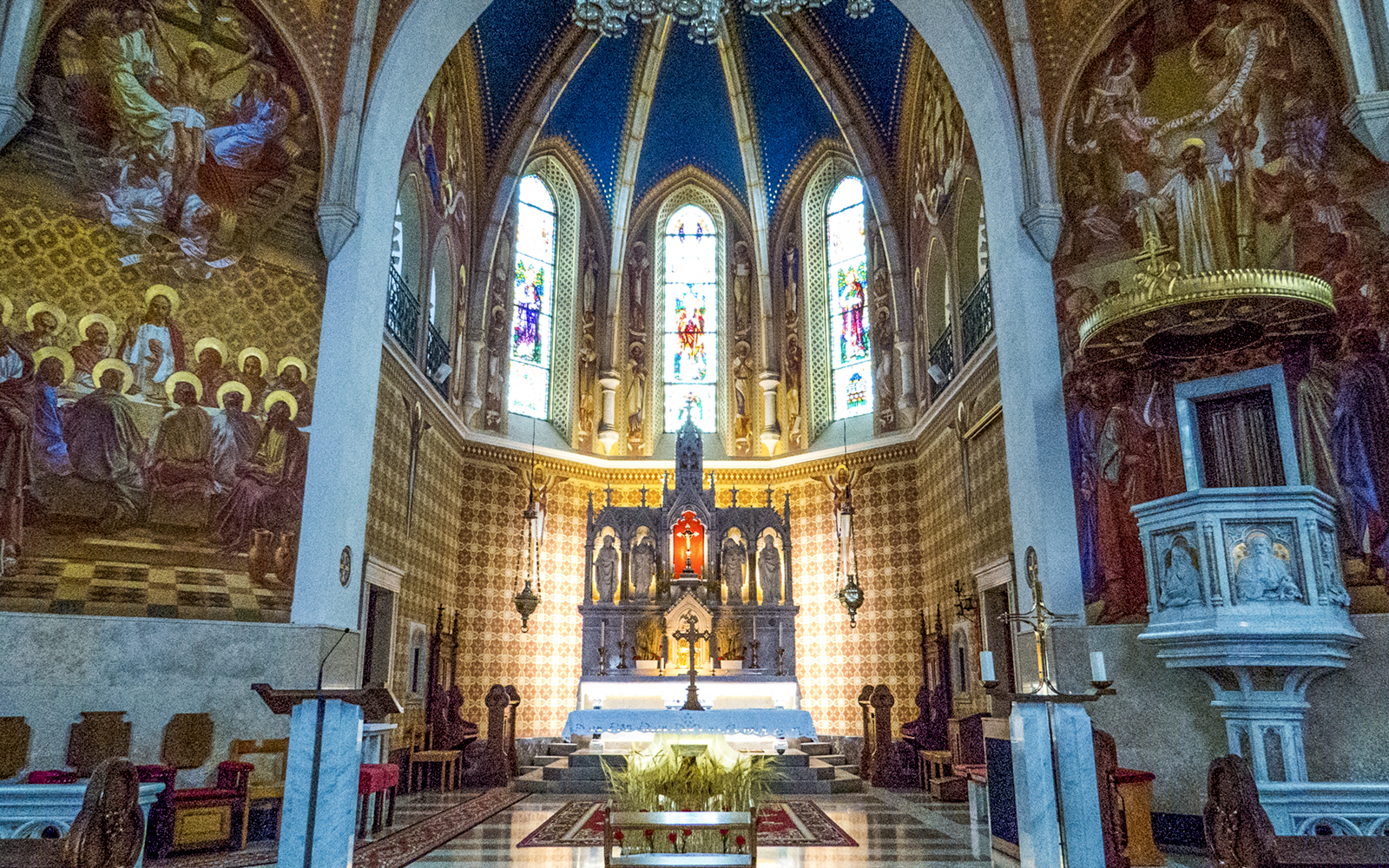 Stained glass and altar inside St. Martin Parish Church, Bled.