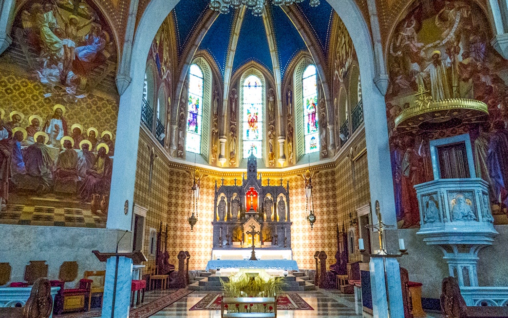 Stained glass and altar inside St. Martin Parish Church, Bled.