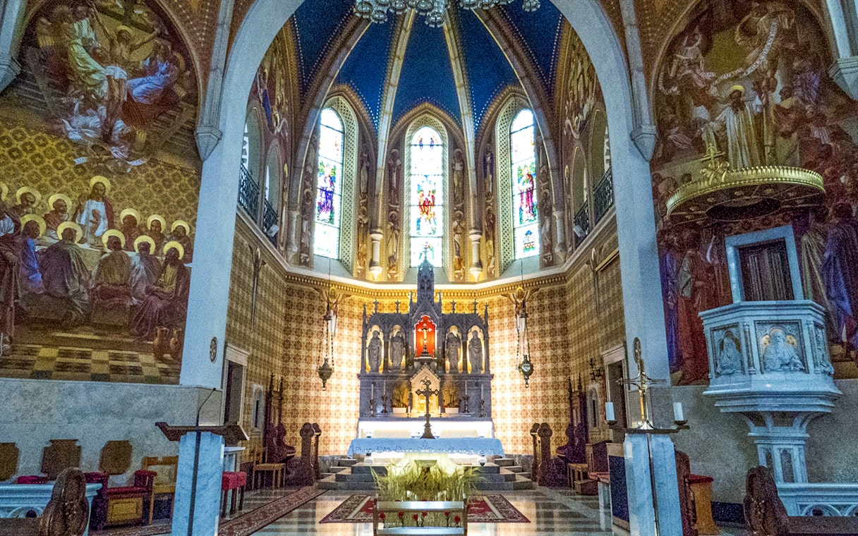 Stained glass and altar inside St. Martin Parish Church, Bled.