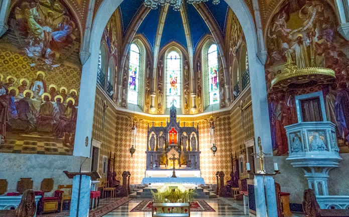 Stained glass and altar inside St. Martin Parish Church, Bled.