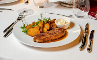 Steak dinner with potatoes and cream served at Burlesque Dinner Club, Vienna.