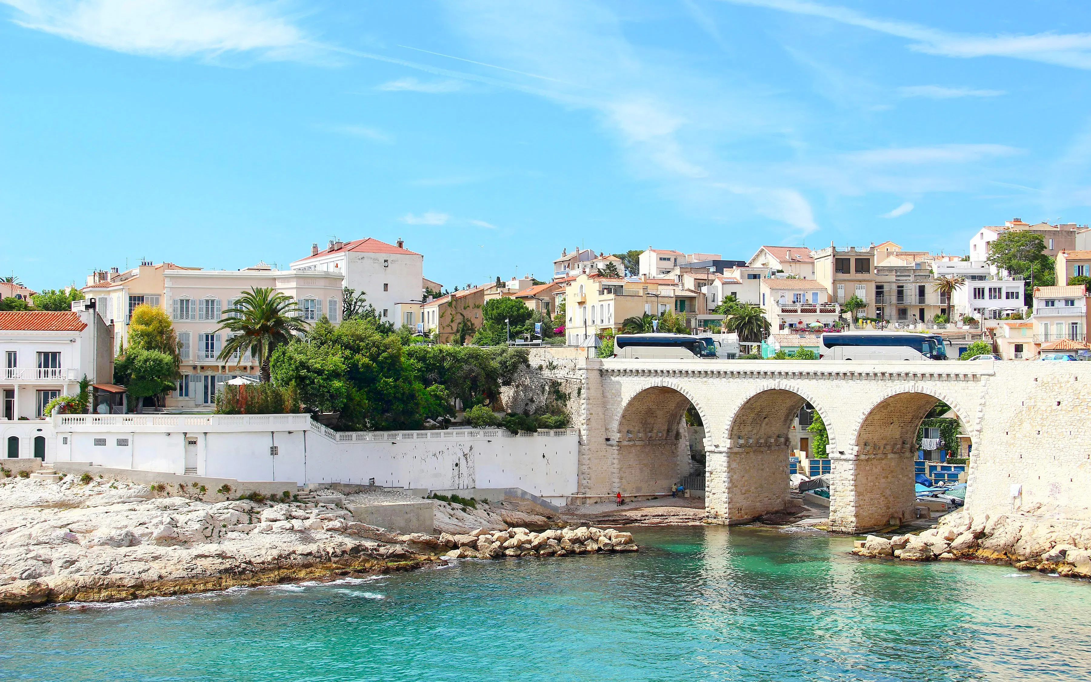 Vallon des Auffes in Marseille with stone bridge and waterfront houses.