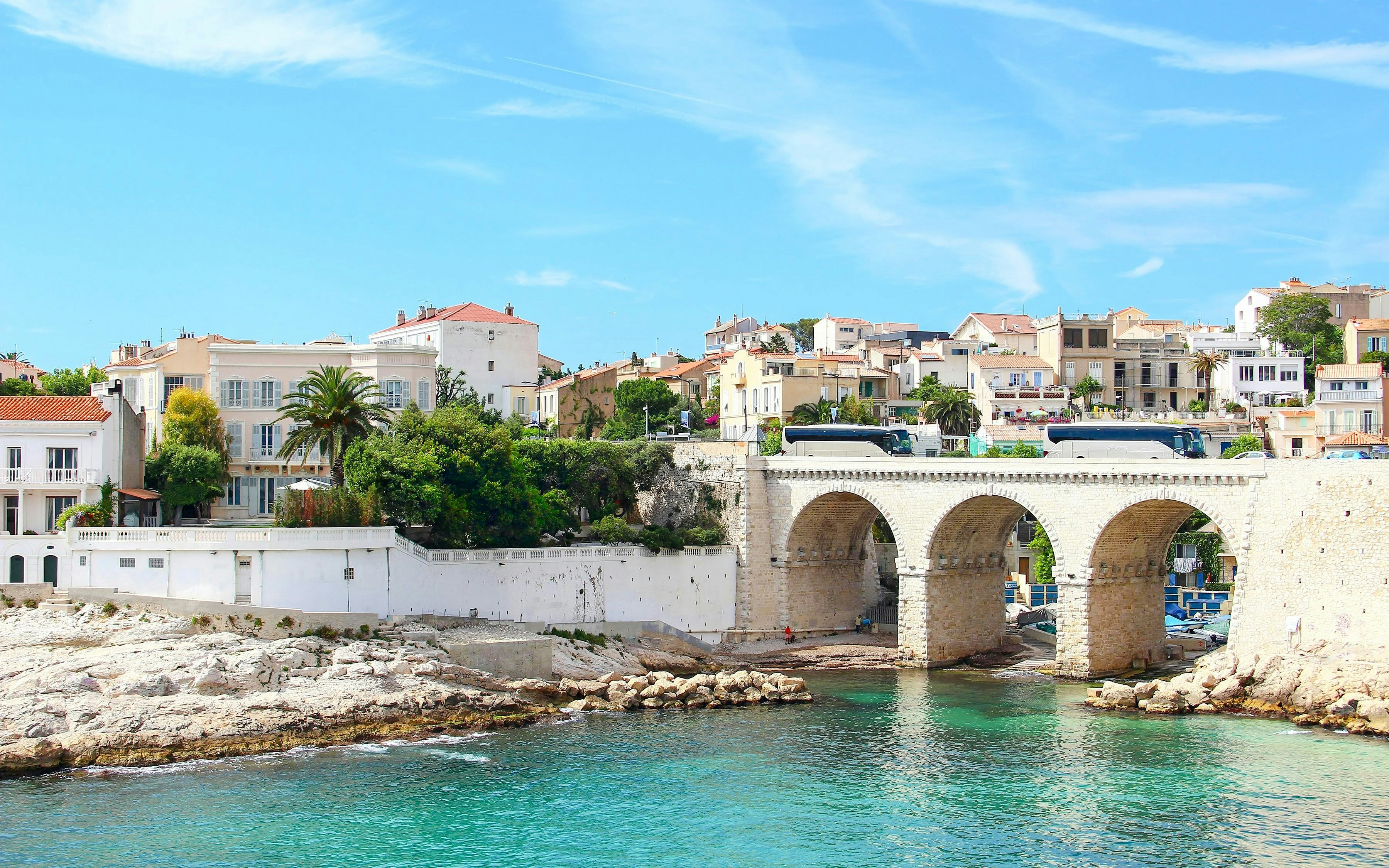 Vallon des Auffes in Marseille with stone bridge and waterfront houses.