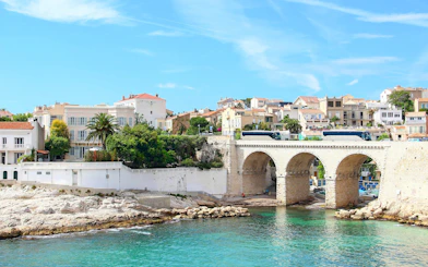 Vallon des Auffes in Marseille with stone bridge and waterfront houses.