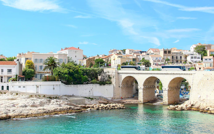 Vallon des Auffes in Marseille with stone bridge and waterfront houses.