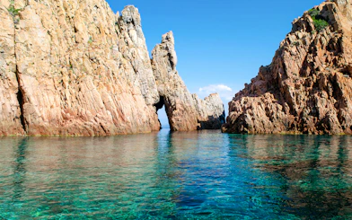 Calanques de Piana rock formations with clear blue water in Corsica, France.