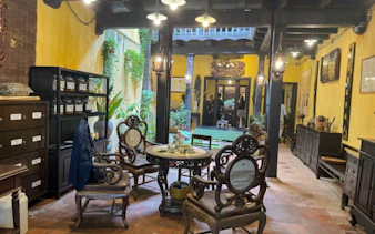 Traditional Vietnamese tea room with antique furniture in Hanoi.