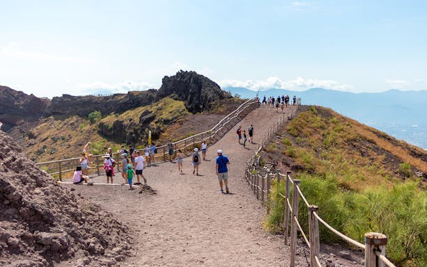 Visitors walking along the path on Mount Vesuvius, Italy.
