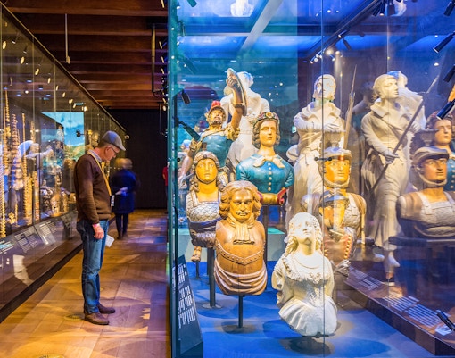 visitors observing ship decorations exhibit at national maritime museum tickets