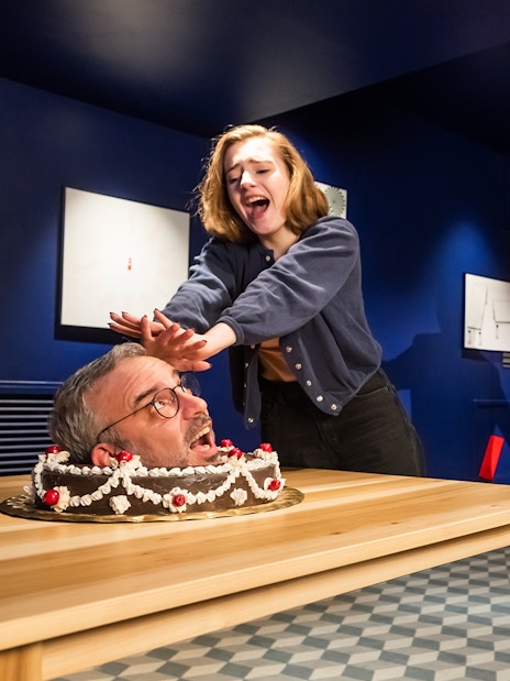 Visitors interacting with wax figures at Grévin Paris Wax Museum.
