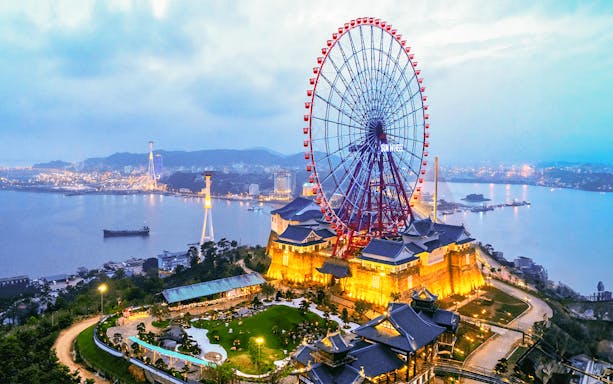 Sun Wheel at Sun World Halong overlooking Ha Long Bay at dusk.