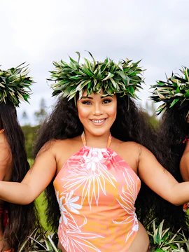 Dancer in traditional attire at Mauka Warriors Luau, Hawaii.