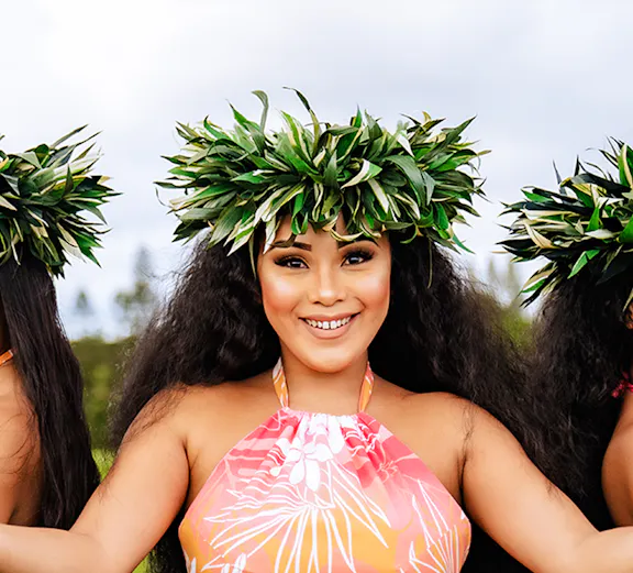 Dancer in traditional attire at Mauka Warriors Luau, Hawaii.