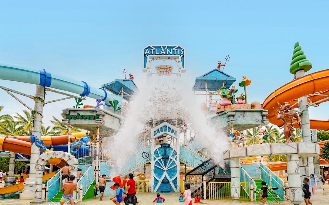 Atlantis Ancol water park entrance with slides and fountains, Jakarta.
