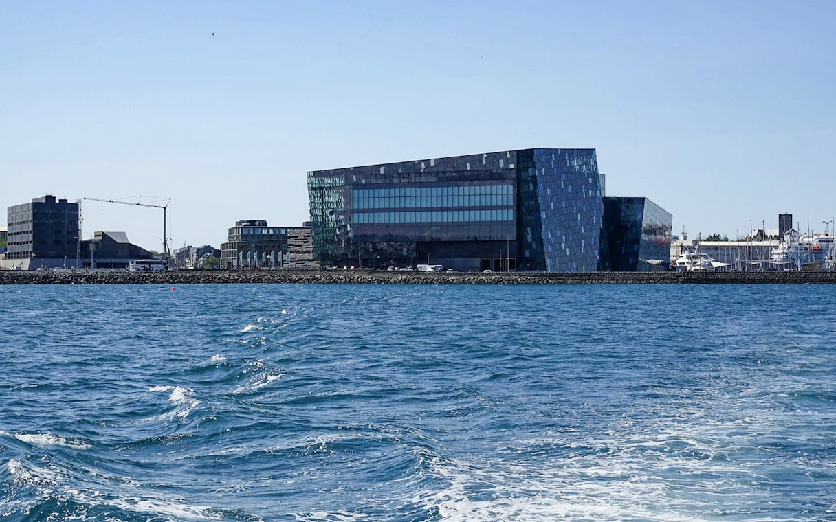Harpa Concert Hall viewed from a whale watching RIB speedboat tour in Reykjavik.