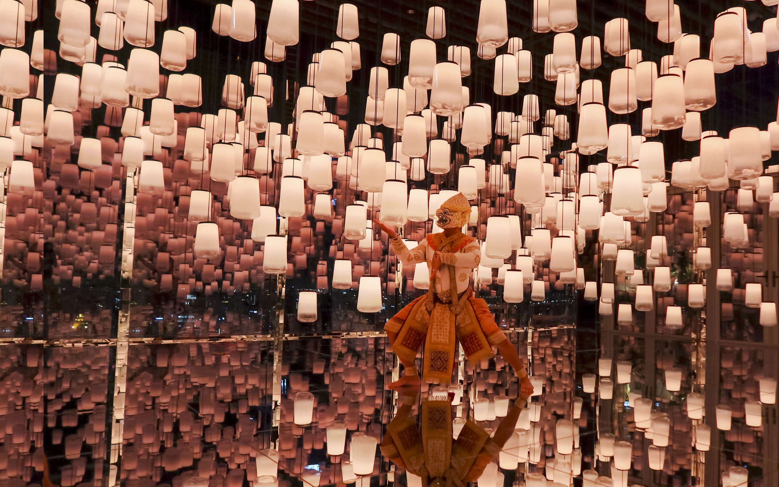 Hanuman figure in Bangkok's Akara Sky attraction with virtual sky lanterns.