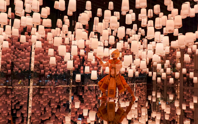 Hanuman figure in Bangkok's Akara Sky attraction with virtual sky lanterns.