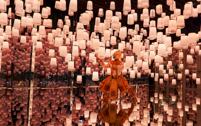 Hanuman figure in Bangkok's Akara Sky attraction with virtual sky lanterns.