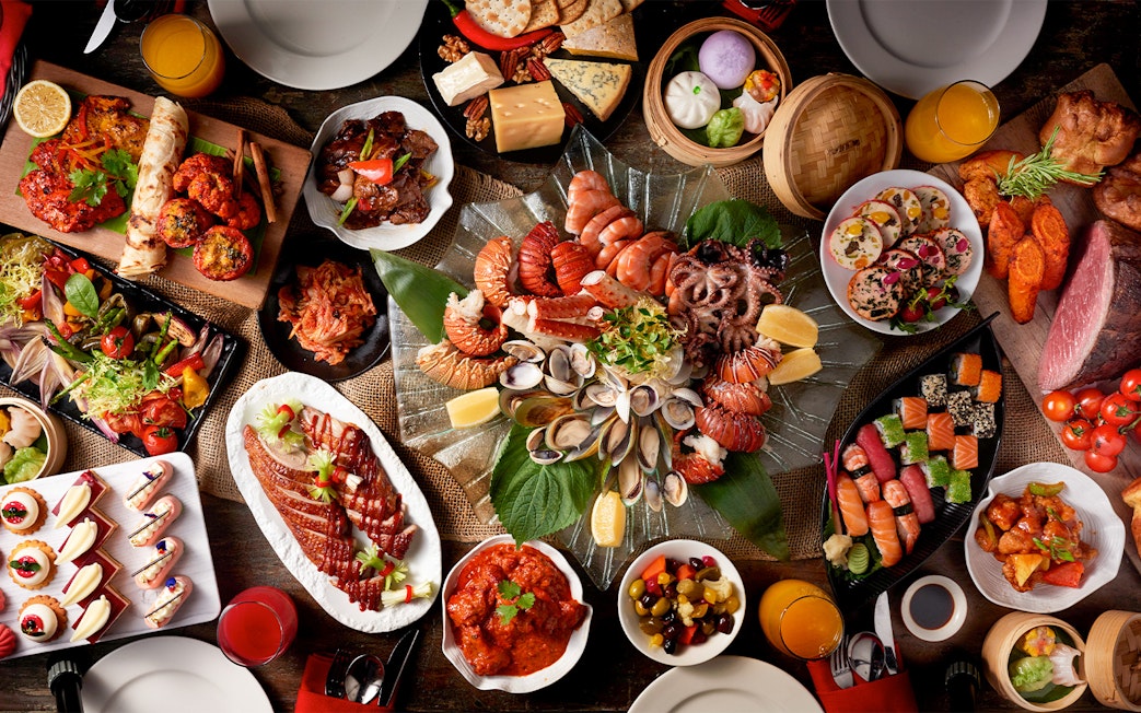 Dinner buffet spread at Atlantis the Palm featuring seafood, sushi, and international dishes.