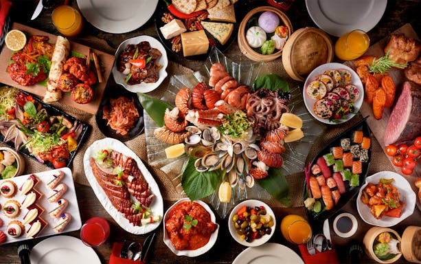 Dinner buffet spread at Atlantis the Palm featuring seafood, sushi, and international dishes.