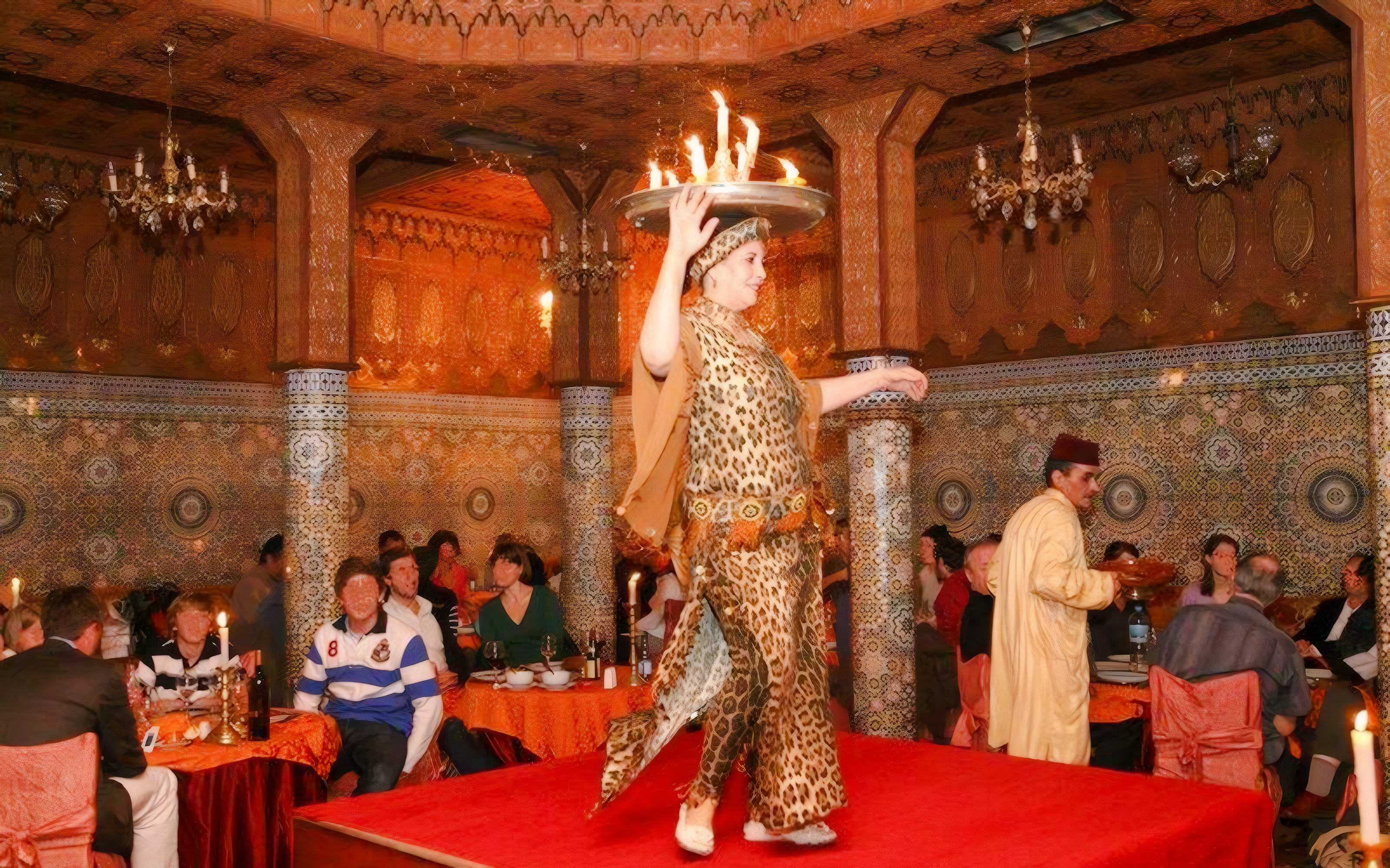 Performer balancing flaming tray at Dar Essalam Moroccan Dinner show.
