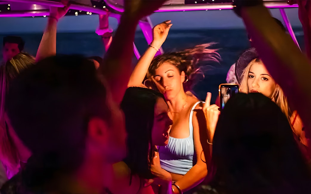 Girl dancing at a party on a Dubai Marina yacht.