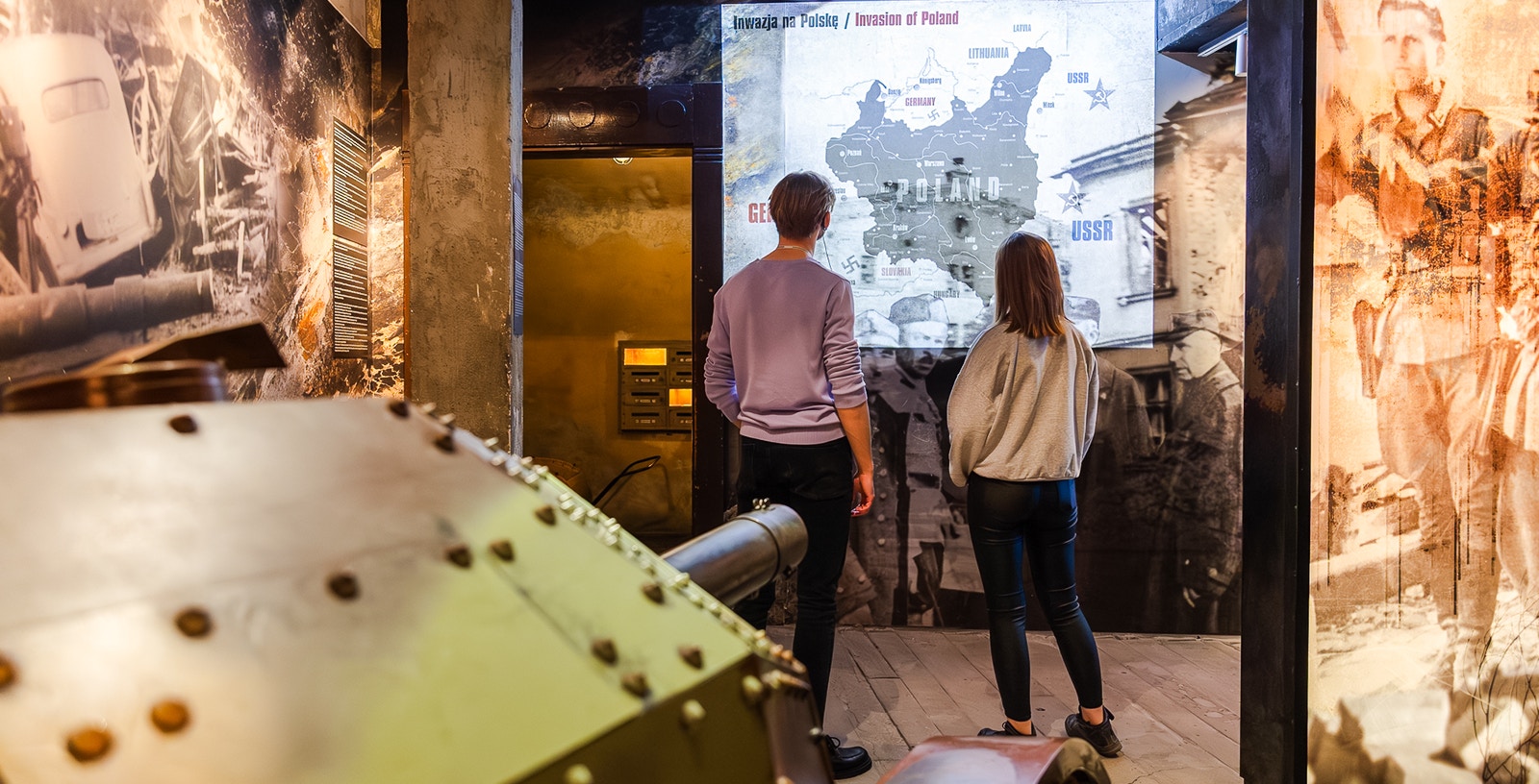 Visitors viewing historical exhibits at Oskar Schindler's Factory in Krakow, Poland.