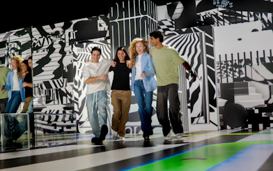 Group enjoying interactive art installation at House Of Hype.
